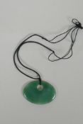 A Nephrite jade pendant necklace, 7 x 5cm