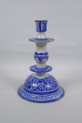 A blue and white tin glazed ceramic hookah base/candlestick, 25cm high