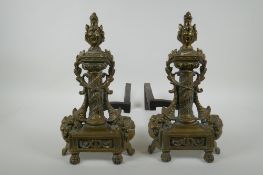 A pair of antique brass andirons with column and cornucopia decoration, 34cm high