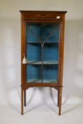 An Edwardian inlaid mahogany display cabinet with painted decoration and single glazed door,
