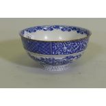 An oriental bowl with blue and white transfer decoration, 15cm diameter