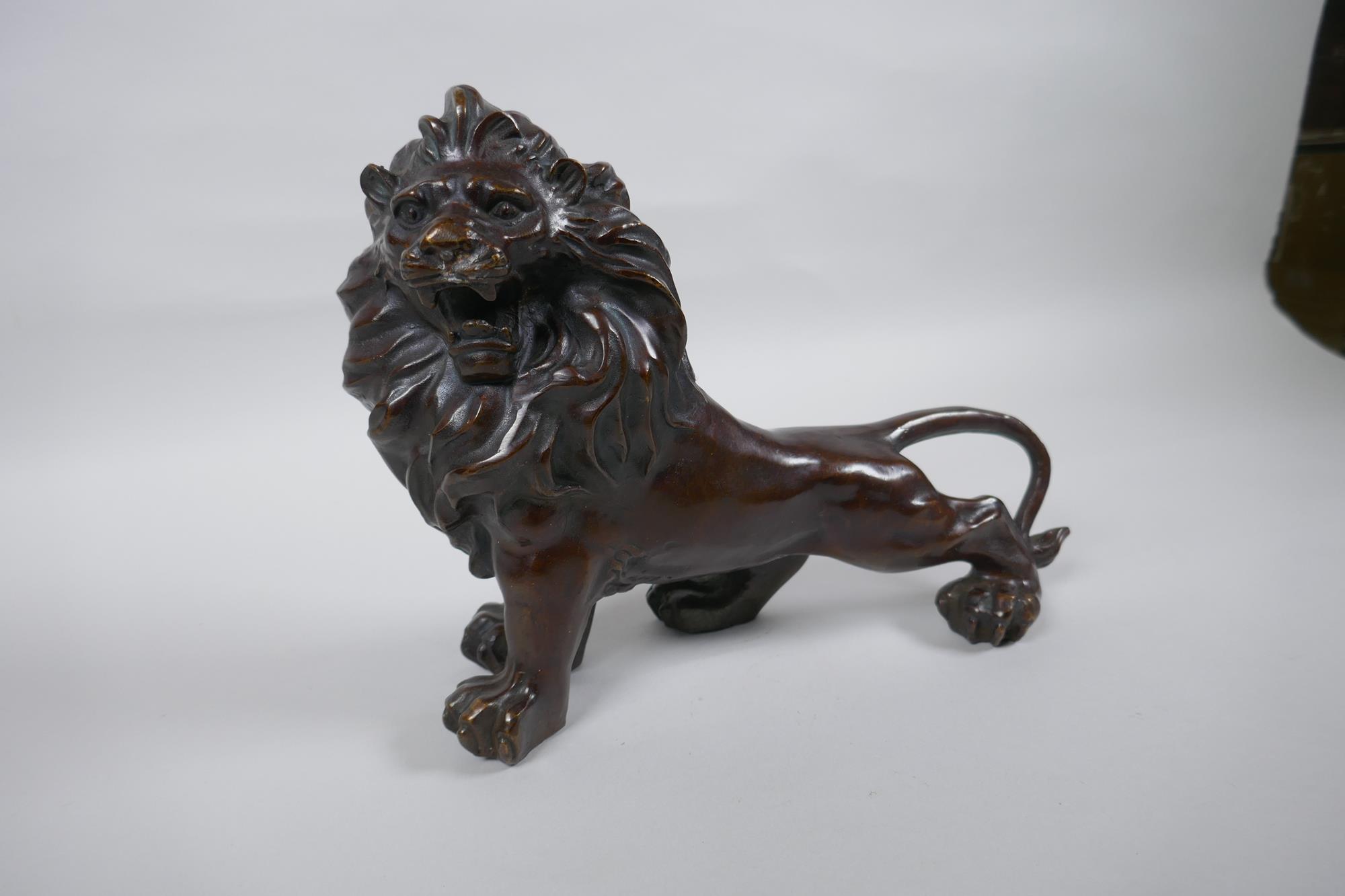 A filled bronze figure of a lion, 26cm long - Image 3 of 3