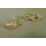 Antique mother of pearl spoon carved from a conch shell, 25cm long