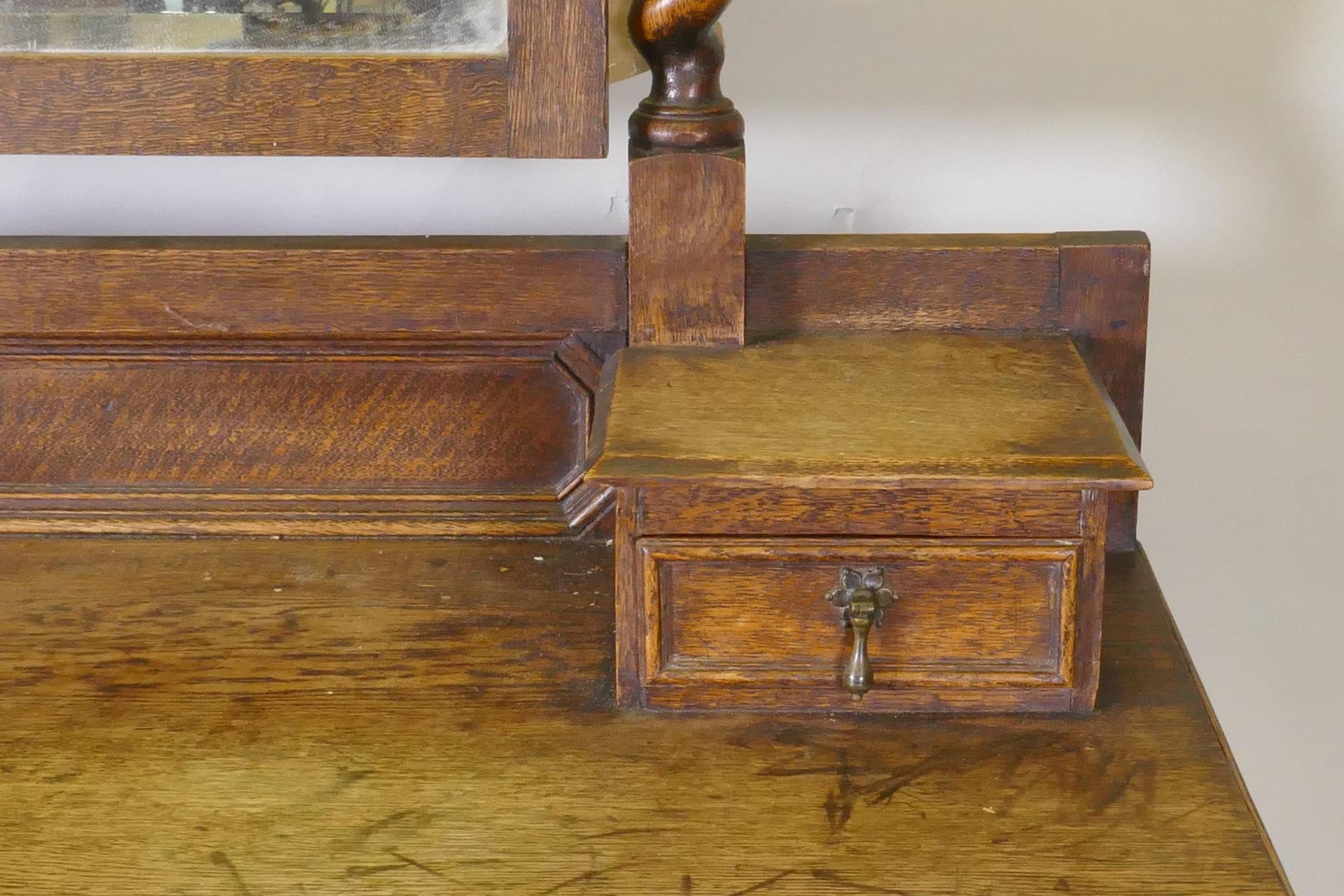 An early C20th oak Jacobean style dressing table, with swing mirror supported by barley twist - Image 3 of 4