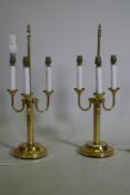 A pair of three branch brass table lamps, 63cm high