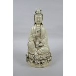A Chinese blanc de chine porcelain Quan Yin, impressed marks verso, 26cm high