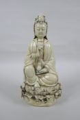 A Chinese blanc de chine porcelain Quan Yin, impressed marks verso, 26cm high