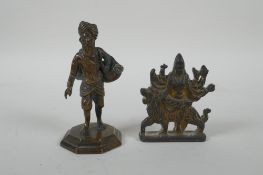 An Indian cast bronze Sikh watercarrier, and an Indian gilt bronze figure of the goddess Mata,