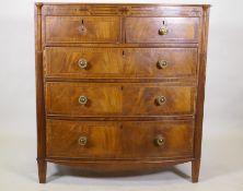 A Regency mahogany bowfront chest, with inlaid frieze and two over three drawers, flanked by