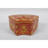 A Chinese coral red ground porcelain box and cover with yellow dragon decoration, JiaJing 6