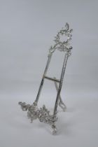 A silvered metal easel, 40cm high