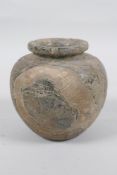 An antique Eastern pot, 10cm high