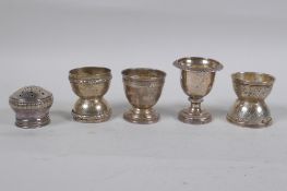 Four C19th French silver egg cups and shaker top, 132g