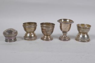 Four C19th French silver egg cups and shaker top, 132g