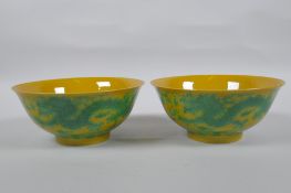 A pair of yellow ground porcelain bowls with incised and green glazed dragon decoration, Chinese3