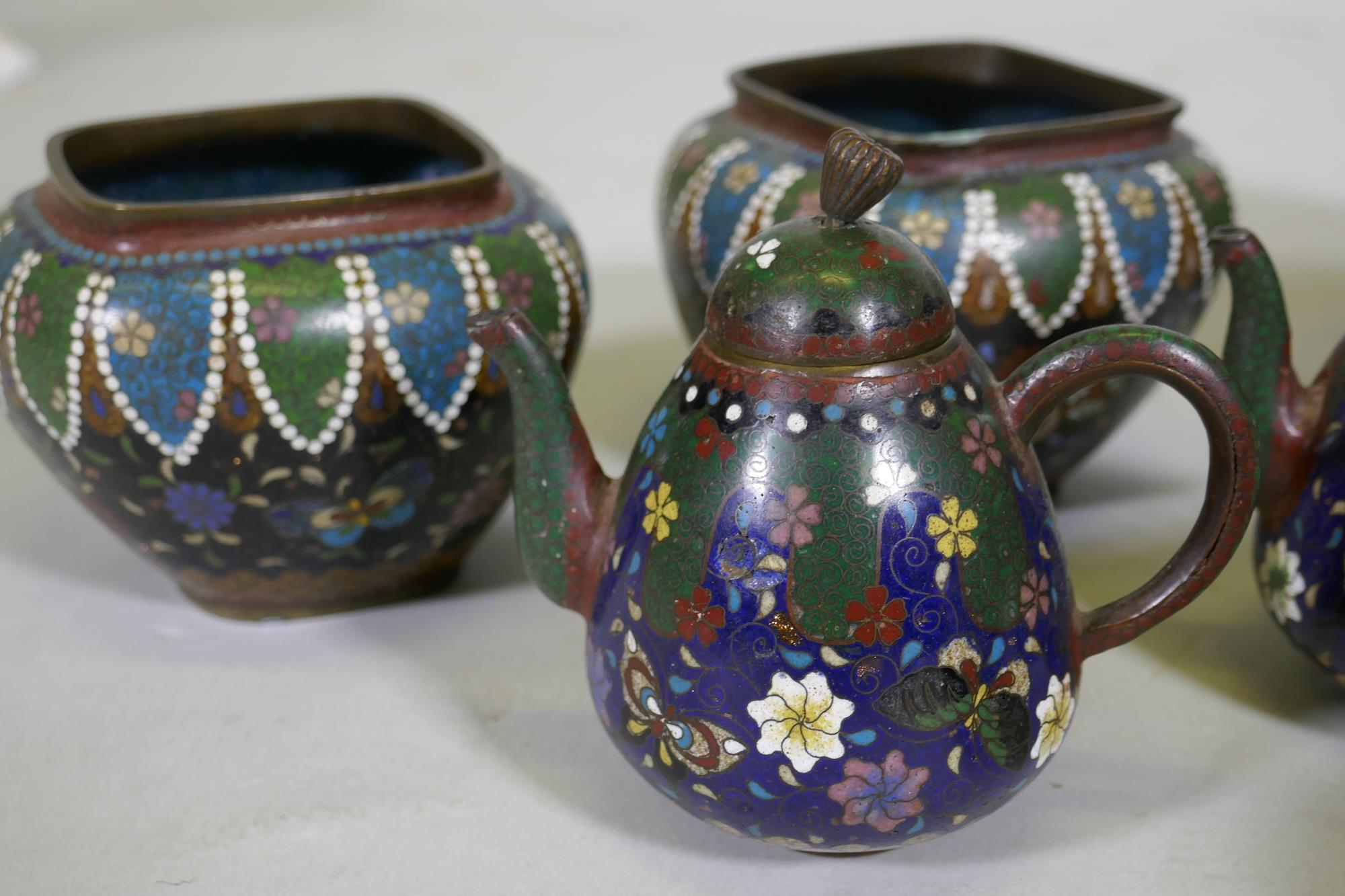 An antique oriental cloisonne potpourri, with ginbari panels, 13cm high, lacks knop to cover, a pair - Image 8 of 9