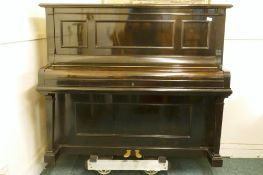 A 1920s Julius Bluthner upright pianoforte supplied by Waring and Gillow, with iron frame, No.