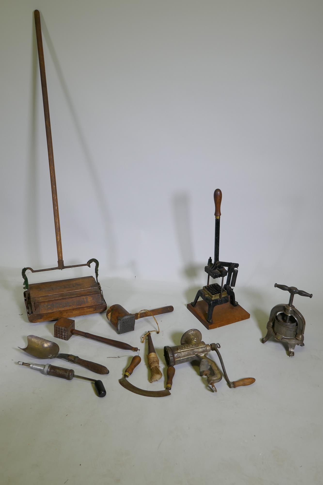 A quantity of vintage kitchenalia, to include a cast metal French fruit/cheese press, a cast iron
