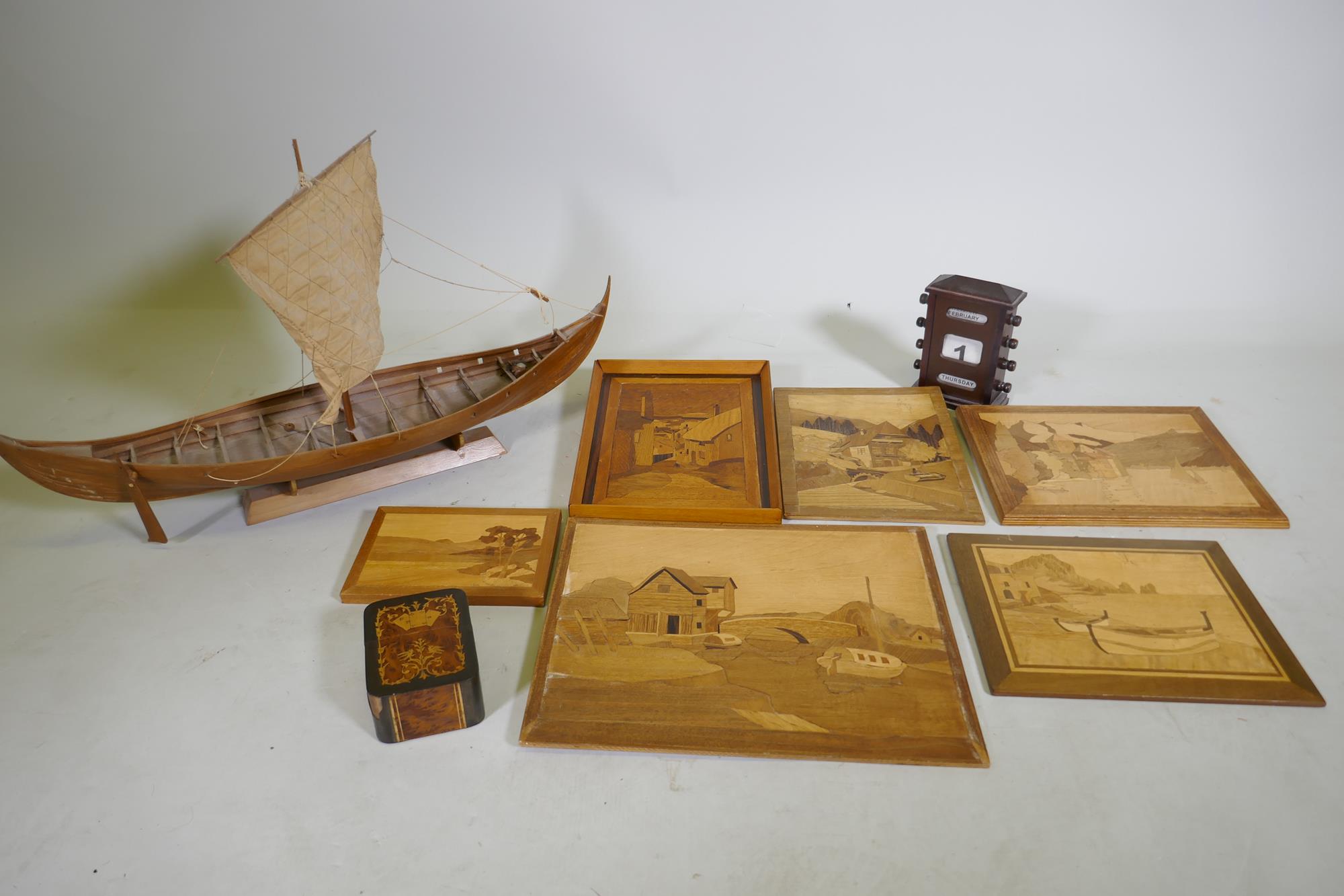 A wood model of a Viking longship, 68cm long, a marquetry panel signed George Wylder, five others, a