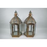 A pair of coppered metal hexagonal lanterns, 49cm high