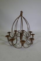 A wrought iron 9 branch candle chandelier, 75cm drop