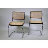 A pair of Italian mid century Marcel Breuer B32 Cesca dining chairs, with tubular chrome frames,