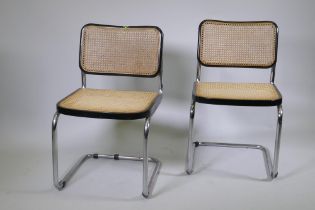 A pair of Italian mid century Marcel Breuer B32 Cesca dining chairs, with tubular chrome frames,