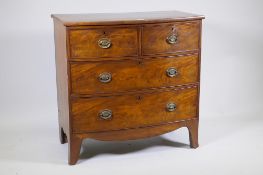 A George III mahogany bow front chest of two over two drawers, with cockbeaded detail and brass