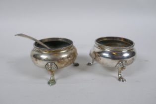 A pair of hallmarked silver salts by Samuel Whitford, London 1869, and a Georgian silver salt spoon,