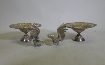 A pair of Victorian Walker and Hall silver plated tazza, and a pair of silver plated fighting cocks,