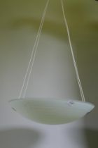 A contemporary hanging ceiling light with glass shade, 54cm diameter, 112cm max drop
