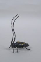 A Japanese style bronze okimono elderberry  longhorn beetle with gilt splash decoration to the