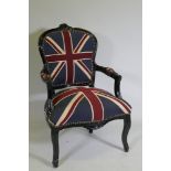 A Louis style black painted open armchair upholstered in Union Flag fabric