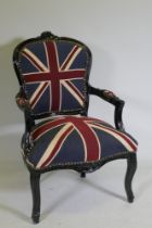 A Louis style black painted open armchair upholstered in Union Flag fabric