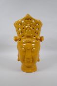 A Chinese yellow crackle glazed ceramic head bust of Quan Yin, 36cm high