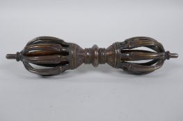 A Tibetan bronzed metal vajra, 20cm long