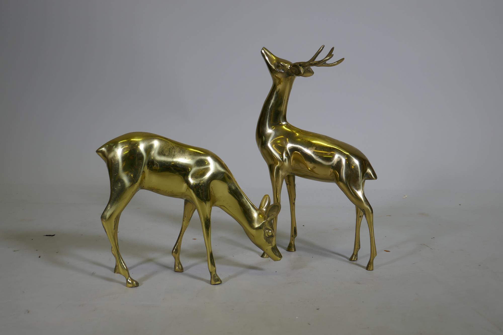 A hollow cast brass figure of a stag and doe, 35cm high