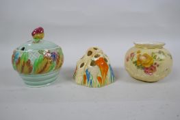 A Clarice Cliff Bizarre Crocus pattern flower frog, a Clarice Cliff for Newport Pottery sugar pot,