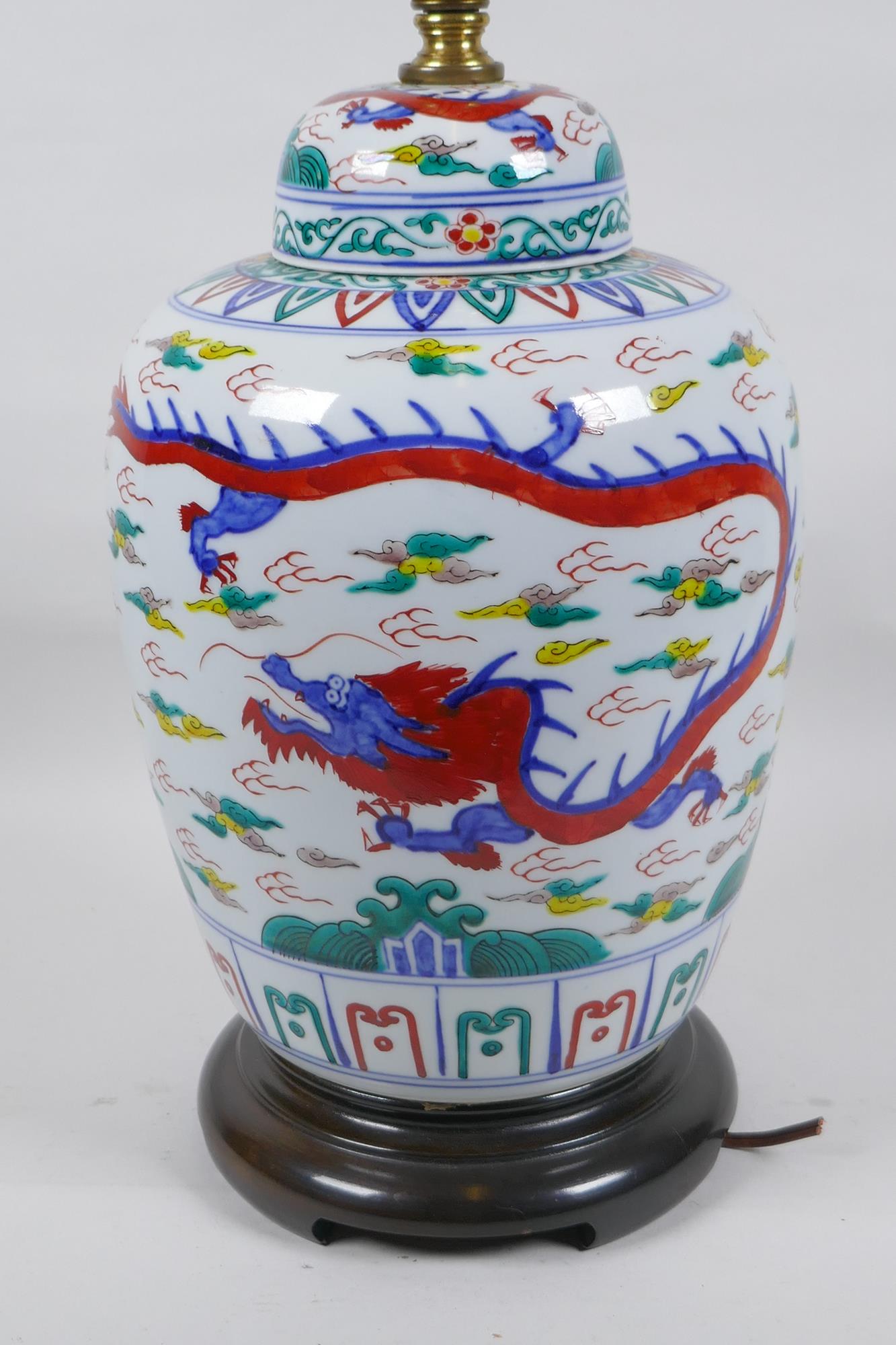 A Chinese Wucai porcelain jar and cover with dragon decoration, converted to a lamp, 41cm high - Image 4 of 5