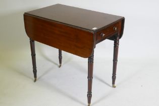 A Georgian mahogany pembroke table with single end drawer, raised on tapering ring turned supports