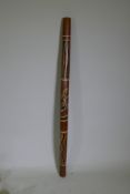 An Australian carved and painted wood digeridoo, 122cm long