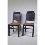 A pair of oriental lacquered wood side chairs with carved backs and woven cane seats