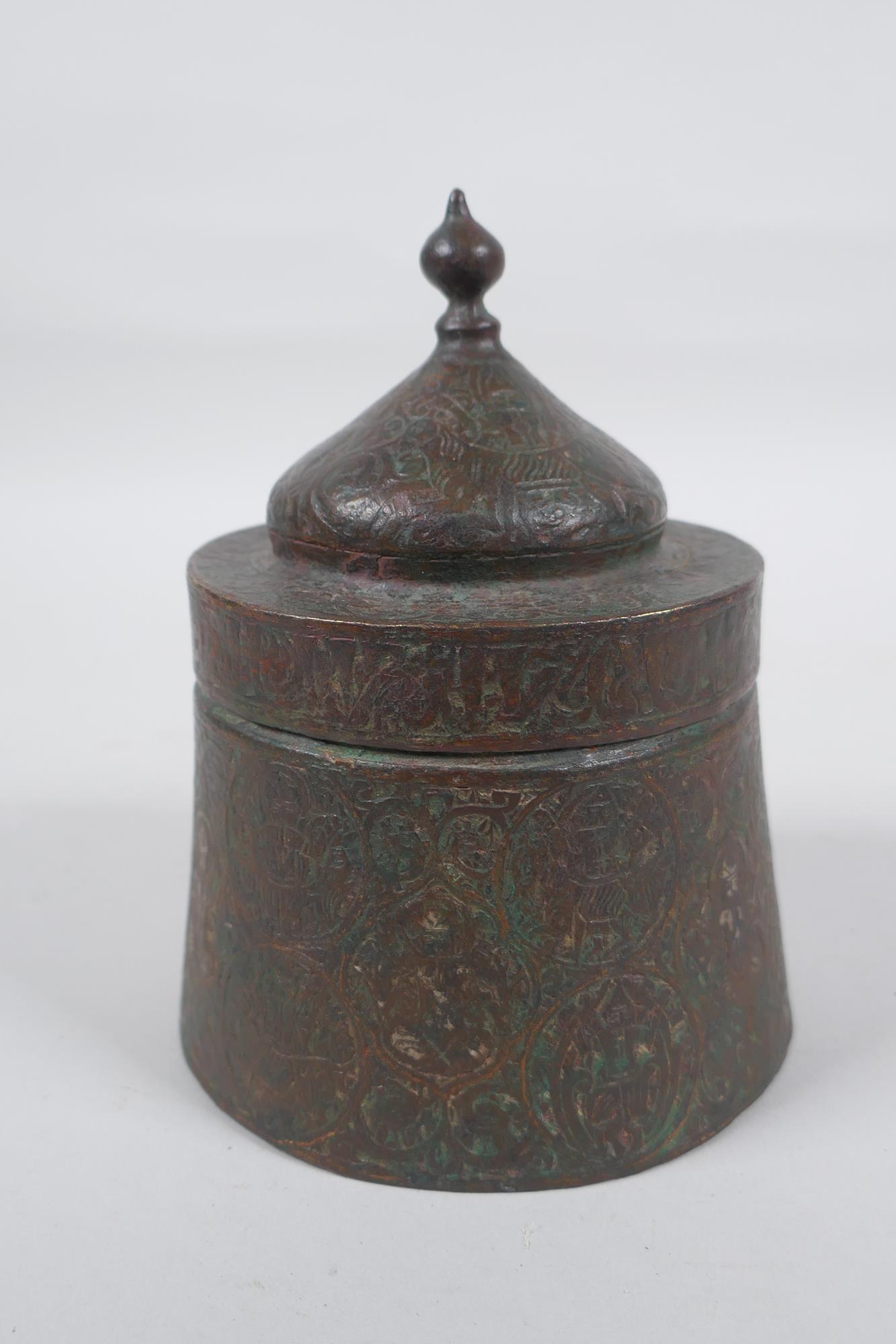 An antique Persian copper ink well with remnants of multi metal inlaid decoration, possibly - Image 4 of 6