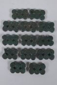 A quantity of bronze belt buckles with a green patina and spiral decoration, 4 x 3cm