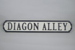 A painted wood Harry Potter 'Dragon Alley' road sign, 14 x 78cm long