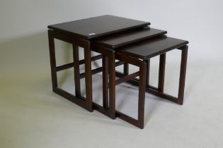 A nest of three mid century rosewood occasional tables, 55 x 44 x 48cm