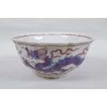 A Chinese polychrome porcelain bowl with lobed rim, decorated with dragons to the exterior and