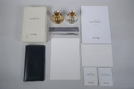 A collection of Concorde related items to include a pair of silver plated candle sticks, leather
