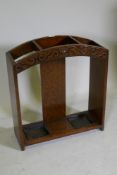 An Art Deco oak stick stand with cared decoration, 68 x 23 x 62cm