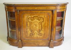 A Victorian inlaid burr walnut credenza with brass mounts, two bow end glazed doors and central